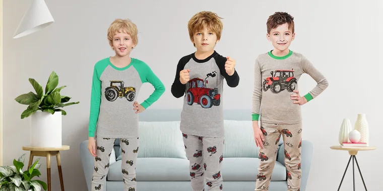 Three boys in Family Feeling tractor print sets